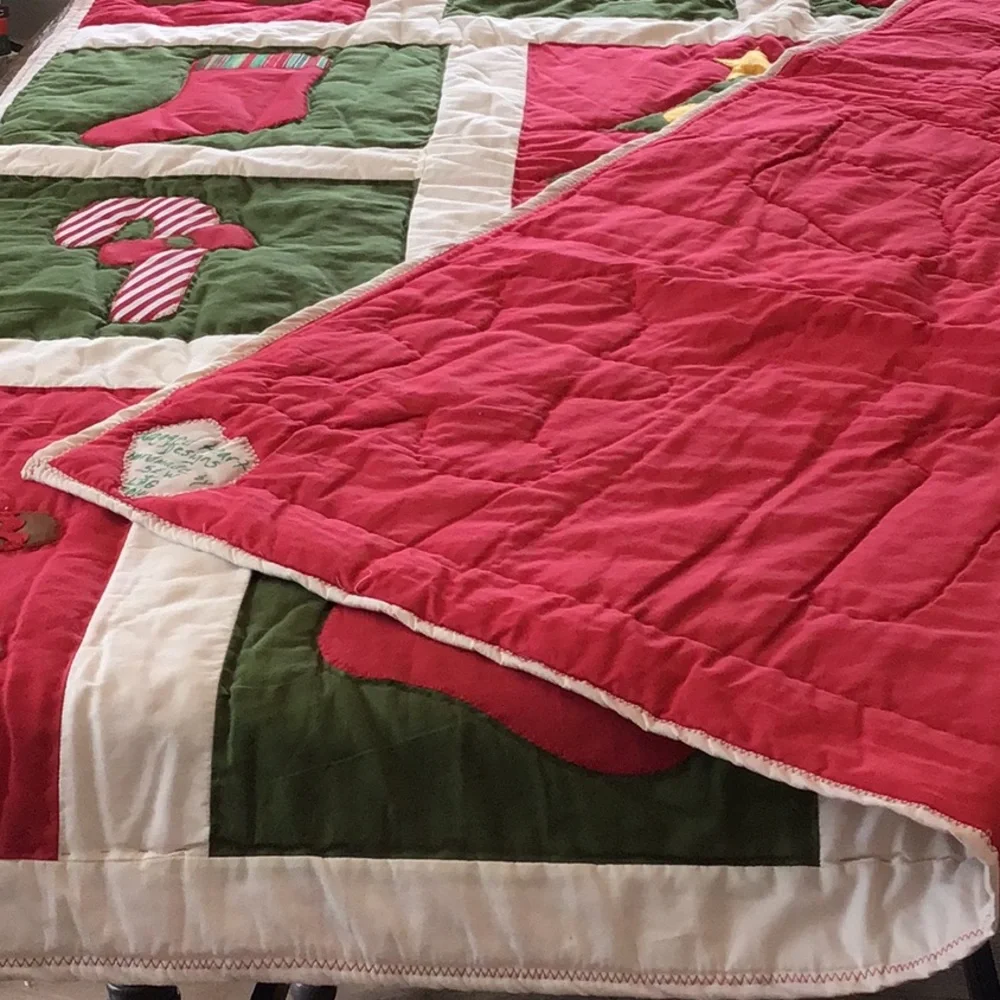 Handmade Christmas-themed applique quilt